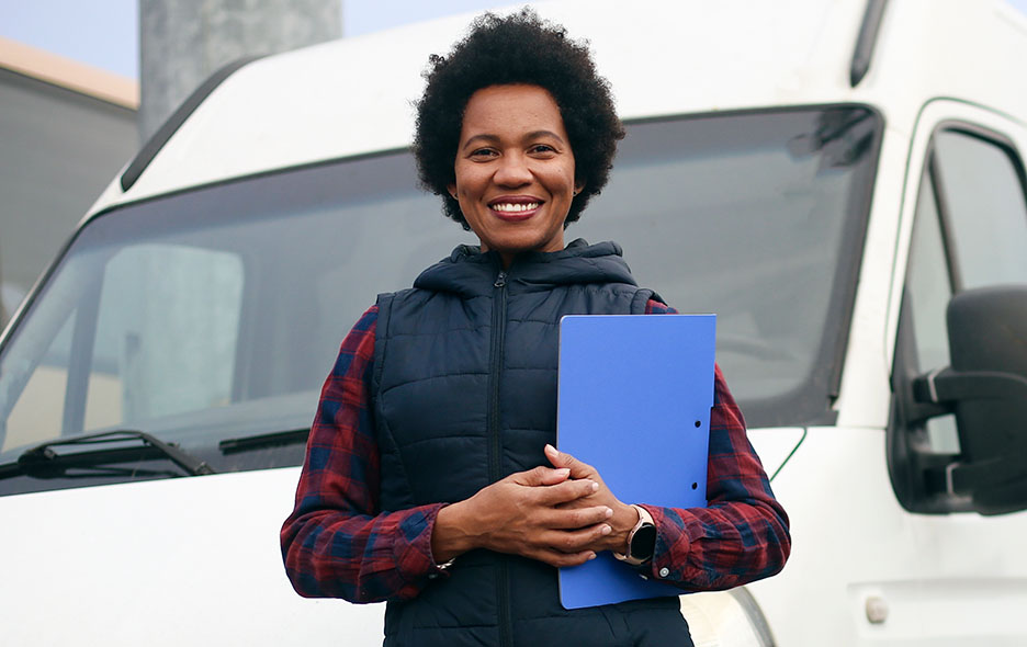 NEMT operator in front of a van