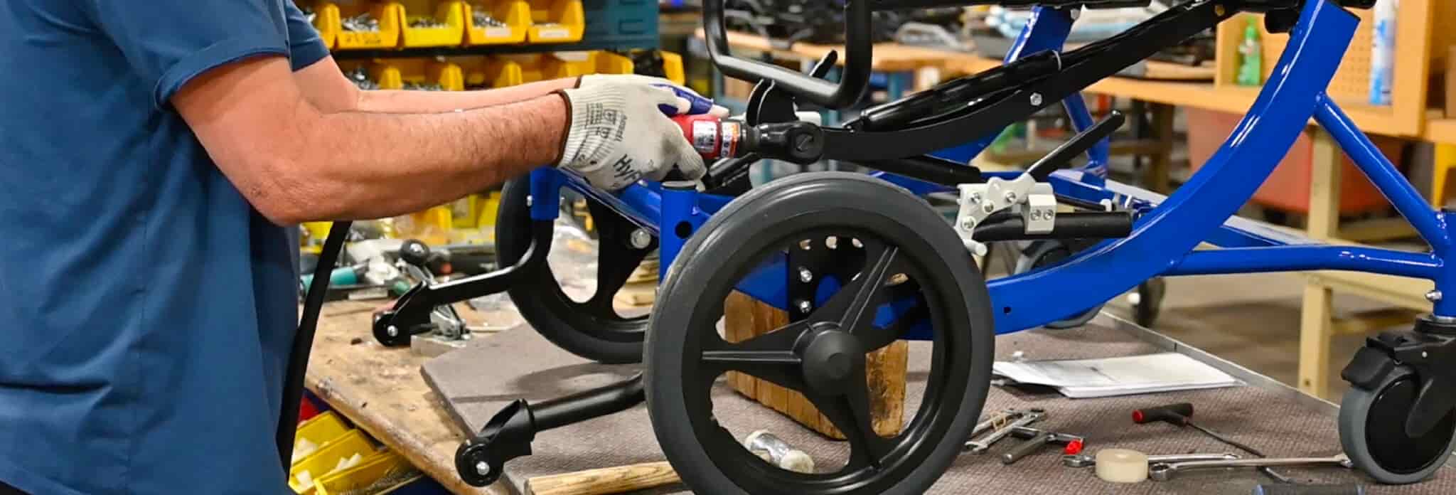 Close up of a manufacturing employee piecing together a chair