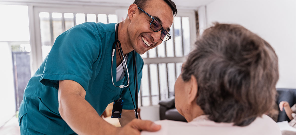 Featured image of a caregiver interacting with a patient